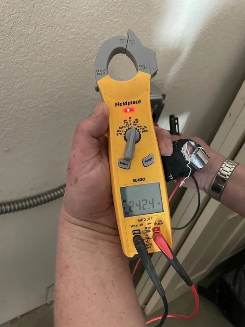 Voltage testing with clamp meter during Outlet Installation in Kinston